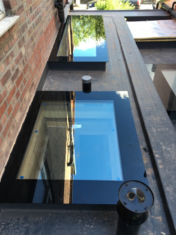 Multiple flat roof skylights on extension in Penge