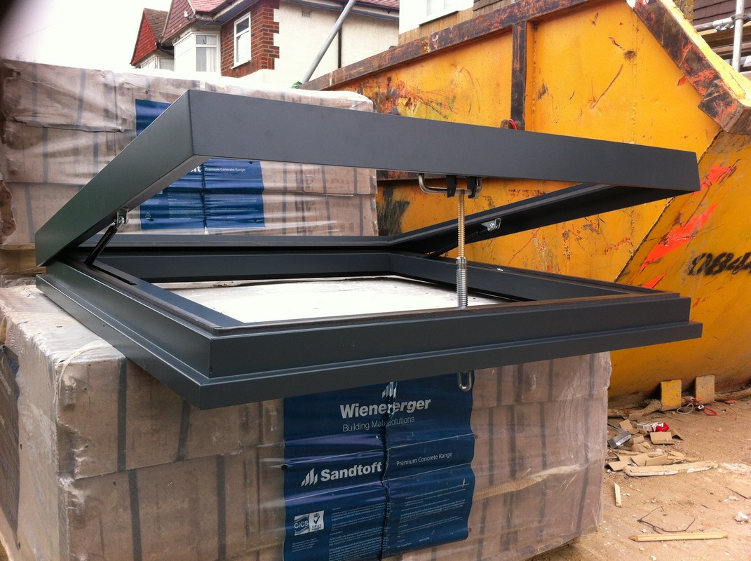 Opening flat roof skylight in anthracite grey installed in Penge